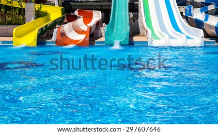ANTALYA, TURKEY - MAY 11, 2014:  Colorful water park tubes and a swimming pool in Delphin Imperial hotel on MAY 11, 2014 in Antalya.