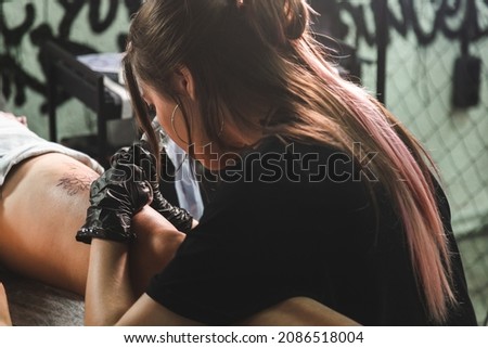 Similar – Image, Stock Photo Master doing tattoo on forearm of male customer