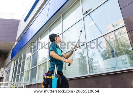 Similar – Image, Stock Photo Man washing window in yellow rubber gloves