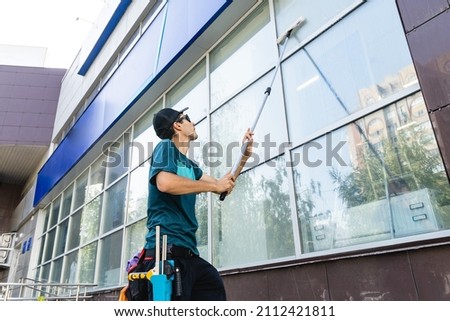 Similar – Image, Stock Photo Man washing window in yellow rubber gloves