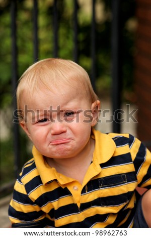 toddler baby infant blonde boy crying pouting sad outside