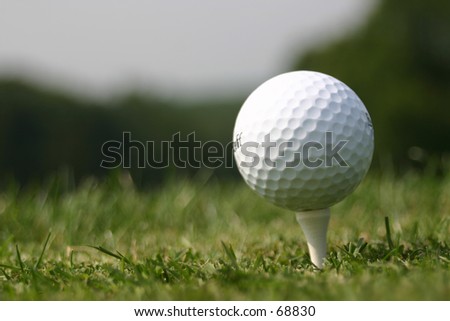 Golf Ball on it\'s Tee. Real Ball, on Real T, On Real Grass on Real Golf Course.