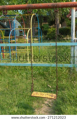 the old metal Swing in Playground under sunlight