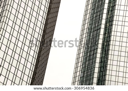cutout of two closely related high business towers