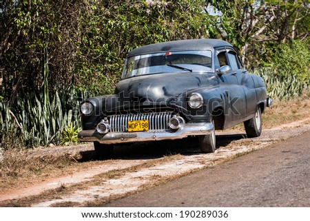 VINALES, CUBA, FEBRUARY 14, 2011: Classic old American car in the village of Vinales. Classic cars are still in use in Cuba and old timers have become an iconic view and a worldwide known attraction.