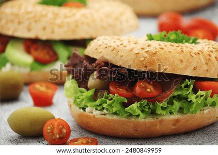 Similar – Image, Stock Photo Vegetable bagel sandwich on wooden table