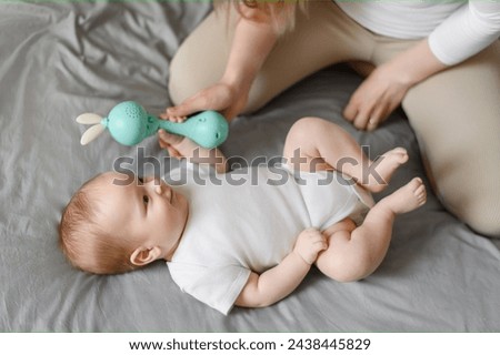 Image, Stock Photo Kid grabs his toy Child