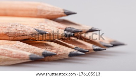 Graphite wooden pencils for sketching shot closeup background