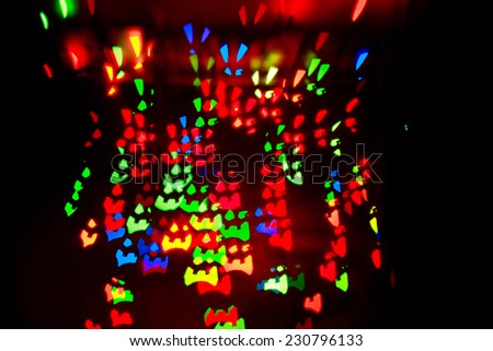 Multicolored abstract background of lights in the form of a rabbit face not in focus