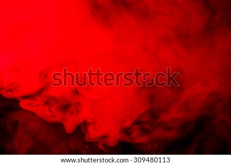 Abstract red-orange hookah smoke on a black background. Photographed using a gel filter. Texture. Design element.