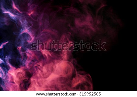 Abstract colored smoke hookah on a black background. Photographed using a gel filter. Texture. Design element.
