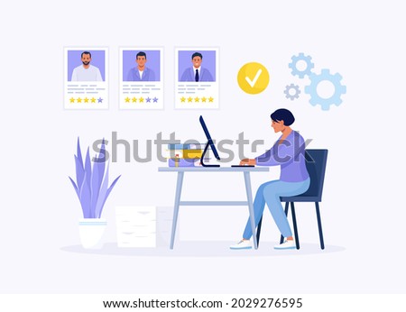 HR Manager working at desk, searching new employee, select resumes of job seekers. Business woman choosing best candidate for job. Recruitment. Agency interview. Human Resource Management and Hiring.