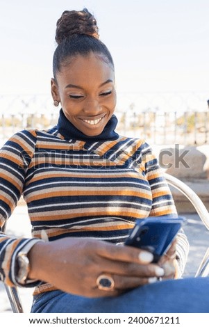 Similar – Image, Stock Photo Delighted black woman browsing smartphone near car