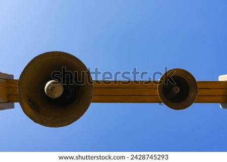 Similar – Image, Stock Photo Copper bells, different sizes on a wooden stick