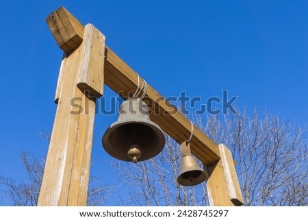 Similar – Image, Stock Photo Copper bells, different sizes on a wooden stick