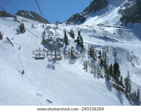 ISOLA, FRANCE - MARCH 26, 2012: Ski runs and a chair lift in ISOLA 2000, a French ski resort in the southern French Alps, located about 90 km from Nice.