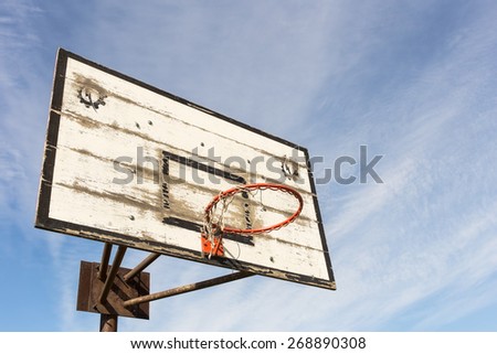 Old street basket hoop over sky