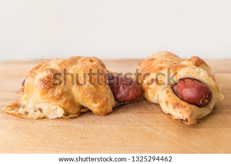 A savoury Czech or Slovak snack food croissant s párkem. A vienna or frankfurter sausage wrapped in pastry. Stock fotó © 