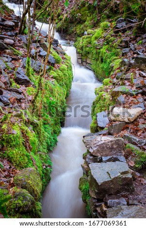 A narrow stepped rocky waterfall on the Elidir Trail; in the Brecon Beacons, Wales. Long exposure Stok fotoğraf © 