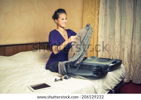 Young asian woman relaxing in hotel room