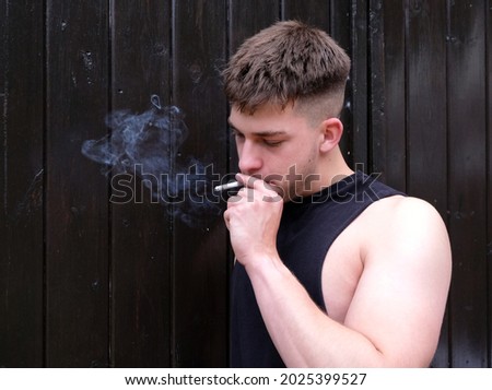 Similar – Image, Stock Photo Adult man smoking cannabis joint