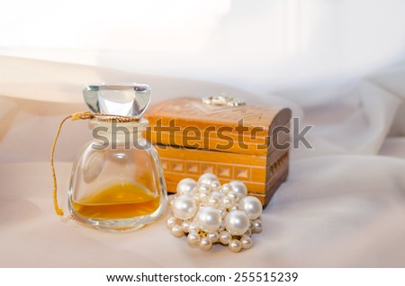Vintage Perfume Bottle with wooden casket and brooch