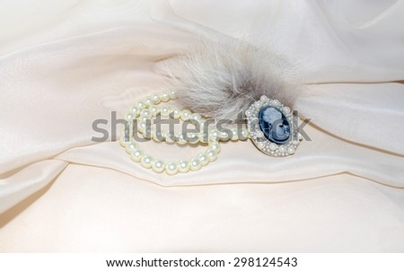 Vintage cameo with fur and pearls