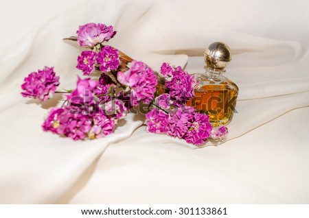 Vintage Perfume Bottle with dry roses