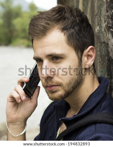 Good Looking Guy on a cell phone