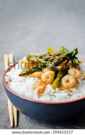 asparagus shrimp stir fry with rice. the toning. selective focus