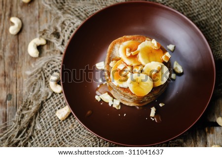 banana cashew pancakes with bananas and salted caramel sauce. the toning. selective focus