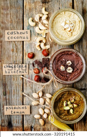 list toasted nut butters, pistachio, hazelnut and cashew. toning. selective focus
