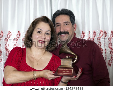 BRONX, NEW YORK - DECEMBER 23: Yomo\'s niece Elizabeth and husband remember Yomo Toro who was awarded Latin Grammy but passed away before he could accept it. Taken December 23, 2012 in the Bronx, NY.
