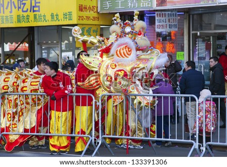 NEW YORK, NEW YORK - FEBRUARY 17: Workers put away dragon costume after the Chinese New Year parade.   Taken February 17, 2013 in  NYC.