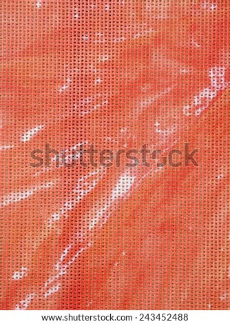 Light red synthetic fabric  background  in sunny day
