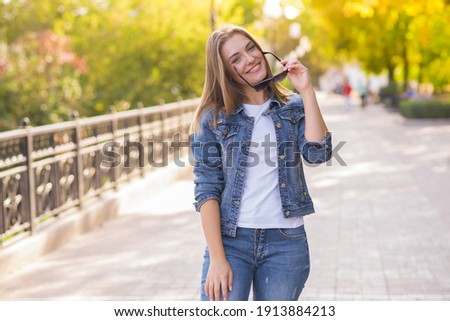 Similar – Image, Stock Photo A sensual image of a naked brunette woman standing and most probably looking into a water reflection. In the clear water of a lake, you can see a blue sky, green trees, and white clouds. All of these details are great but our model’s sexy back is the best.