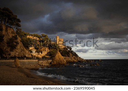 Castell d'en Plajan on the Costa Brava and city beach in Lloret de Mar, Spain. Sand and sea waves. Imagine de stoc © 