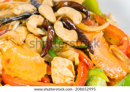 Pad cashew nut with chicken sauteed, white onions, green onions, carrots, dried chili
