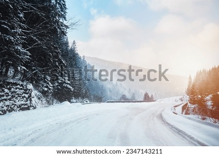 Similar – Foto Bild Verschneite Straße an einem sonnigen Tag im Winter