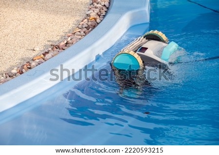 Similar – Image, Stock Photo Swimming pool cleaner robot during vacuum service, maintenance. Top view