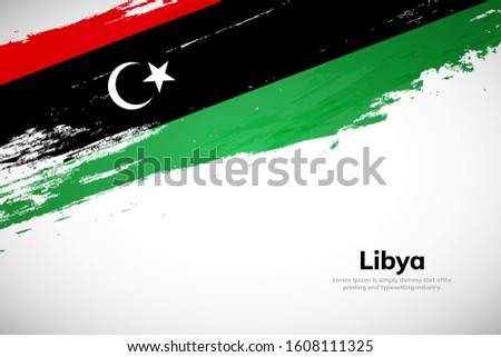 Libya flag made in brush stroke background. National day of Libya. Creative Libya national country flag icon. Abstract painted grunge style brush flag background.