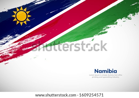 Namibia flag made in brush stroke background. National day of Namibia. Creative Namibia national country flag icon. Abstract painted grunge style brush flag background.