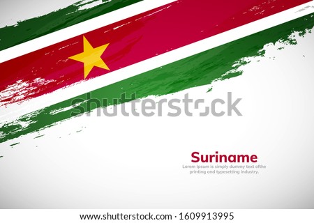 Suriname flag made in brush stroke background. National day of Suriname. Creative Suriname national country flag icon. Abstract painted grunge style brush flag background.