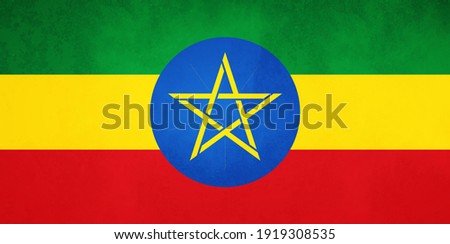 Watercolor texture flag of Ethiopia. Creative grunge flag of Ethiopia country with shining background