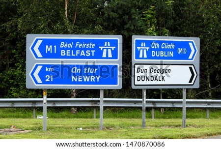 Belfast, Newry, Dublin and Dundalk directional road signs.
