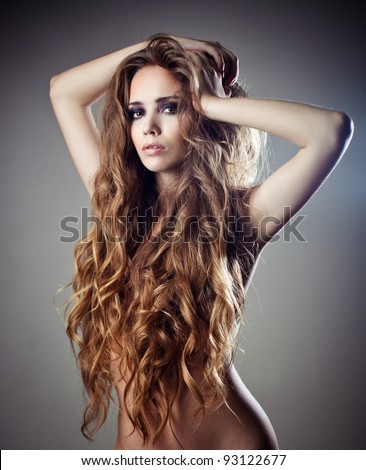 Beautiful sexy woman with long curly hair