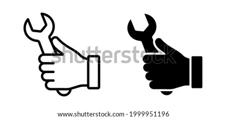 Hand holding repair wrench vector icon