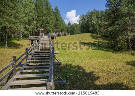 ARKHANGELSK, RUSSIA - AUG 1, 2013: Photo of the wooden staircase. Arkhangelsk State Museum of Wooden Architecture and Folk Art Mallye Korely