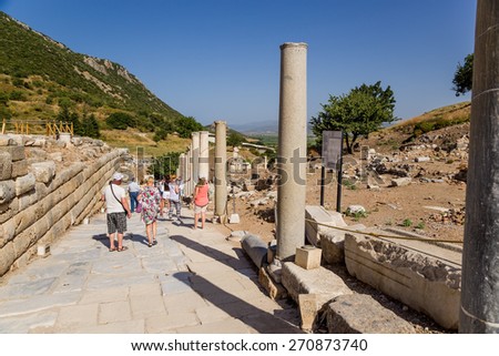 EPHESUS, TURKEY - JUN 28, 2014: Photo of of tourists at one of the ancient streets.  Ephesus is a candidate for inscription on the World Heritage list of UNESCO