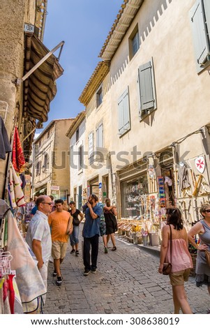 CARCASSONNE, FRANCE - JUL 19, 2015: Carcassonne, France. Tourists in the street of the old town